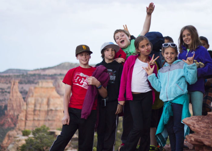 SOS Outreach youth hiking through Monument