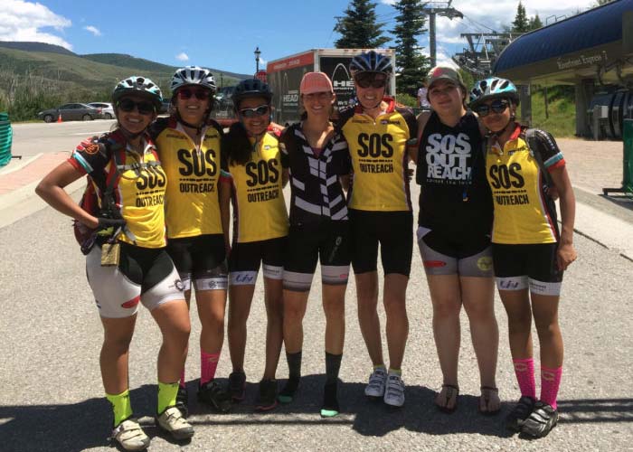 SOS Outreach participants dressed for a bike race