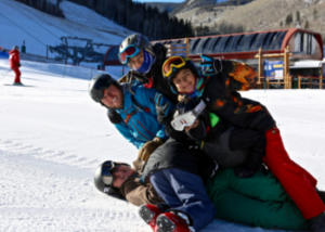 Mentors and SOS Outreach Youth playing on the ski mountain