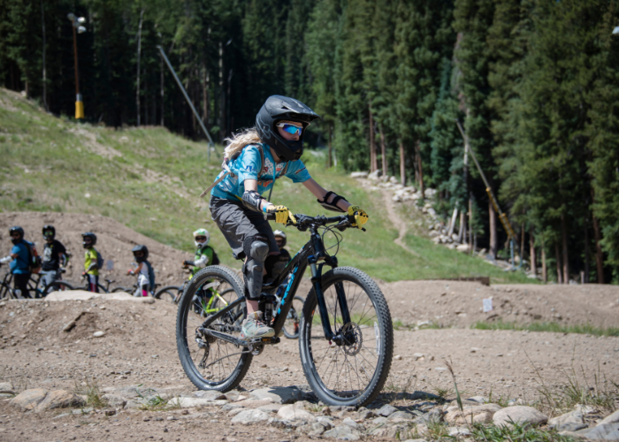 Girl riding a mountain bike at Keystone with SOS Outreach
